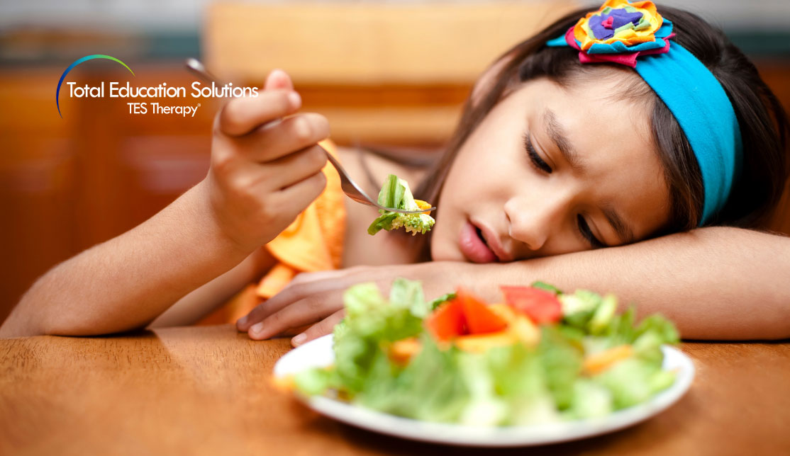 Picky eaters blog banner image. Girl eating salad